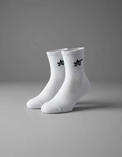 White socks with black logo on a black surface