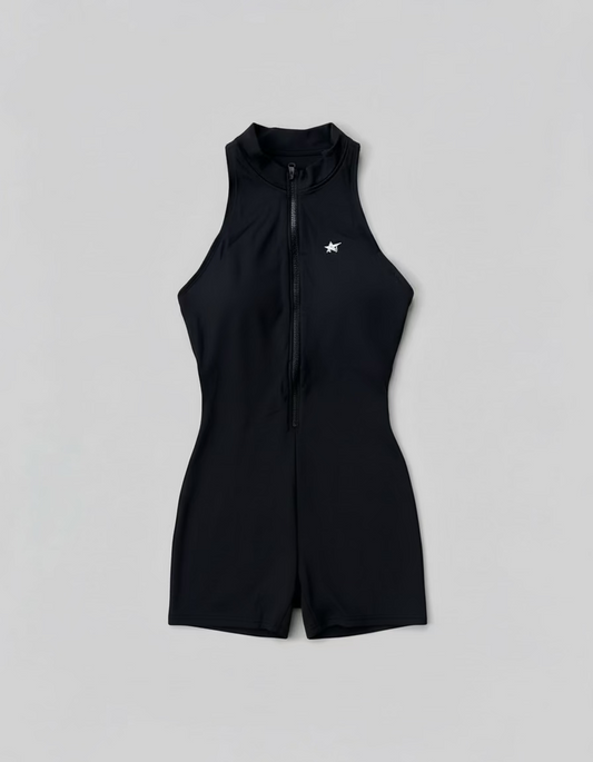 Black sleeveless jumpsuit with a small white logo on a light gray background